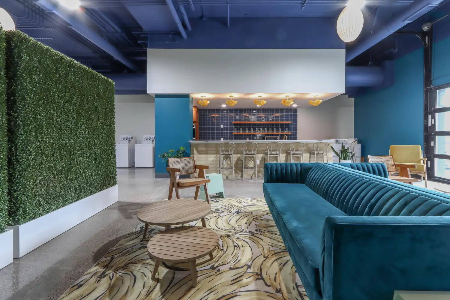 Lounge with a teal velvet sofa at bantr wausau